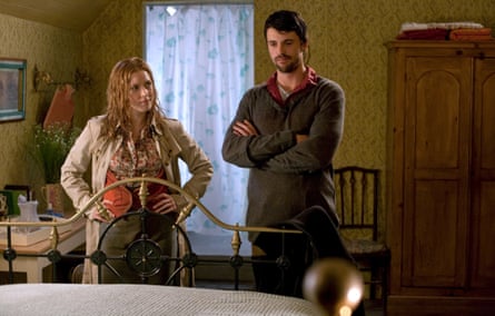 The bedraggled couple in a hotel bedroom