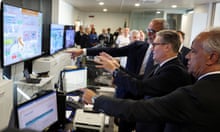 Keir Starmer looks at screens showing the maritime traffic off the Italian coast next to the Italian minister of the interior, Matteo Piantedosi, and the chief of Italian border police, Claudio Galzerano