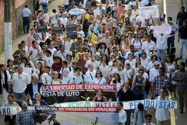 Journalists, activists and civil society members march to demand for justice for the five people killed in the country's capital, including a photojournalist, in Xalapa, Mexico August 10, 2015. The governor of the Mexican state of Veracruz, Javier Duarte, will be questioned over the recent murder of five people in the country's capital, including the photojournalist, the mayor of Mexico City said on Monday. The killings of photographer Ruben Espinosa and four others on July 31 in an apartment in central Mexico City have prompted an outcry from free speech organisations and human rights activists and spurred protests in the capital.
