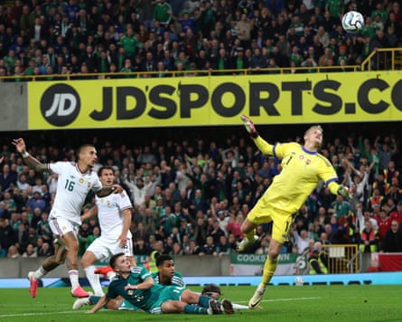 Northern IrelandâÂÂs Patrick Kelly lobs the Hungary goalkeeper.