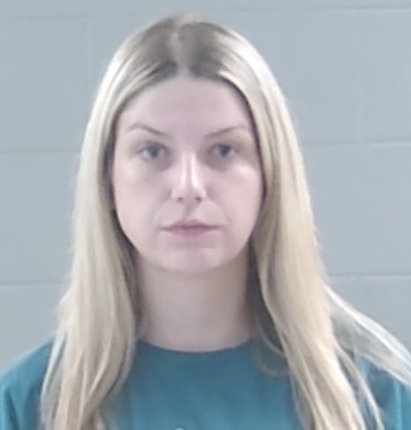 Madison Rebecca Colello, with long blonde hair and a teal shirt, poses for a mugshot