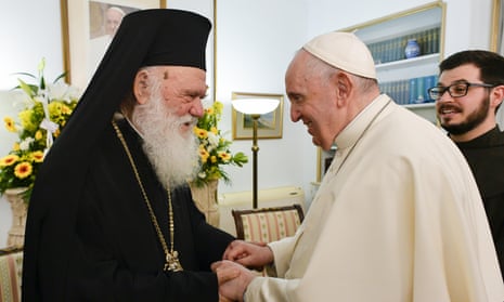 Pope Francis (R) meets with the head of the Greek Orthodox Church Ieronymos II, in December 2021.