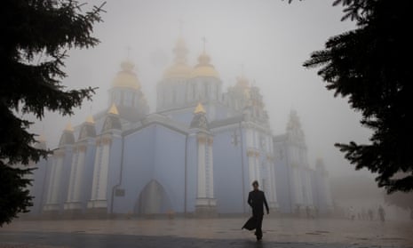 A clergyman walks near St Michael’s Golden-Domed Monastery in Kyiv.