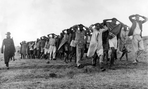 Mau Mau suspects are led away for questioning by police in the Great Rift Valley in Kenya in 1952, during the rebellion against white colonisation.