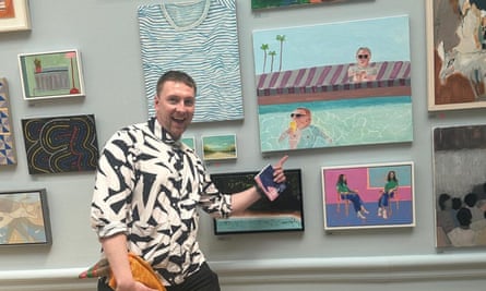 Joe Lycett with his painting ‘‘I drink a crisp, cold beer in a pool in Los Angeles while Gary Lineker looks on in disgust’ at the Royal Academy’s Summer Exhibition 2023.