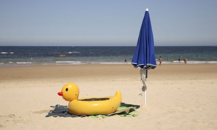 Yellow Inflatable Duck on Comillas Beach, Cantabria, Spain