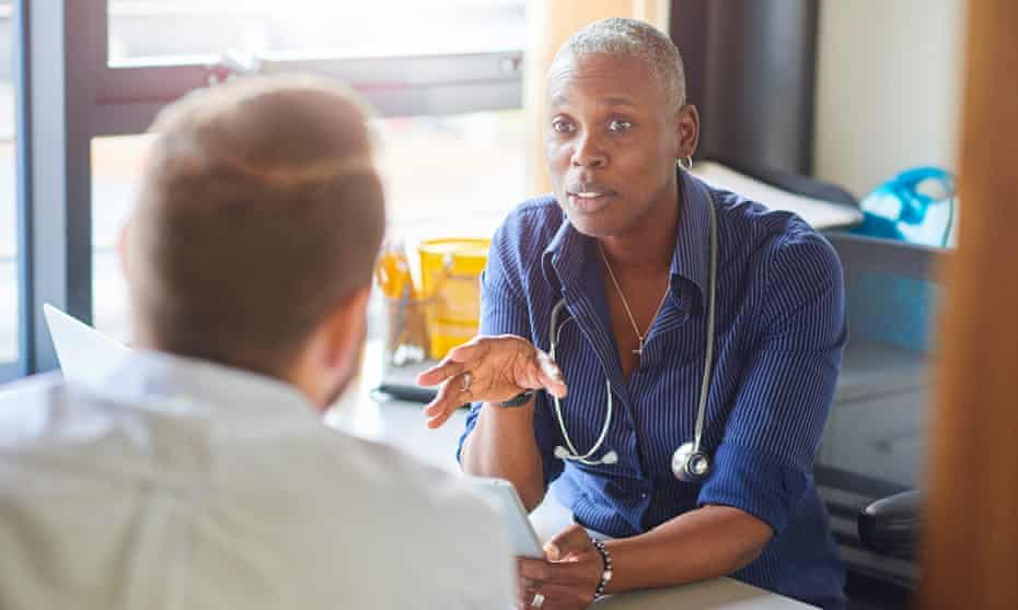 Doctor chatting to male patient