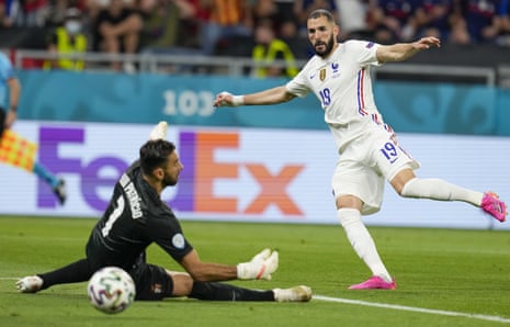 France’s Karim Benzema, right, kicks the ball past Portugal’s goalkeeper Rui Patricio to score his team’s second goal.