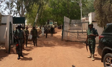 Nigerian soldiers and police officers outside the Federal College of Forestry Mechanisation in Mando, Kaduna state, following the kidnapping
