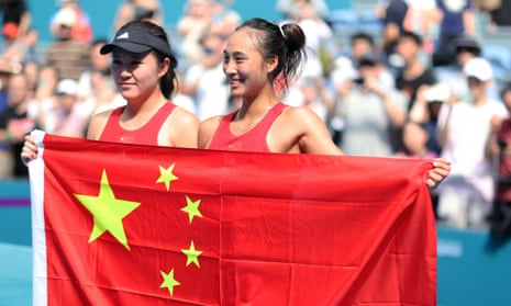 China's Zheng Qinwen and Zhu Lin after the women’s singles final at the Asian Games