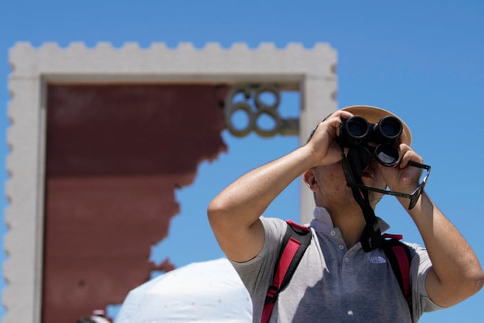 One man holds binoculars in Pingtan island, Fujian province, China.