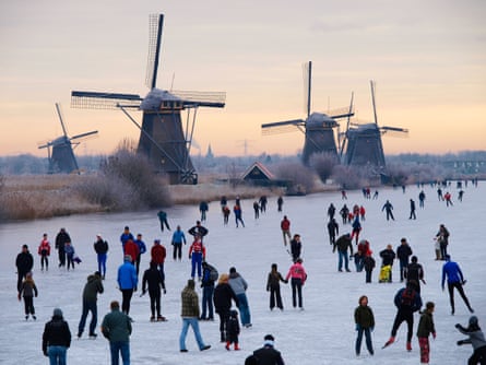 Skaters by Kinderdijk’s windmills.
