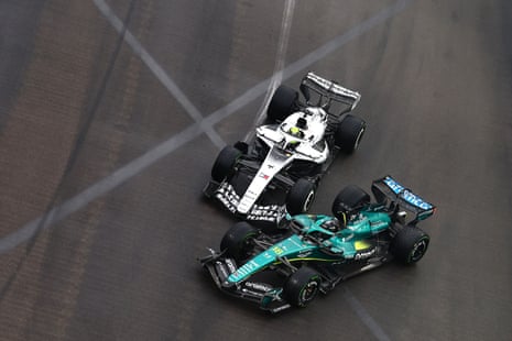 Lance Stroll (right) and Sergio Perez collide.