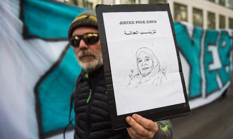 A protester holds a portrait of Zineb Redouane during a march in Marseille in November last year.