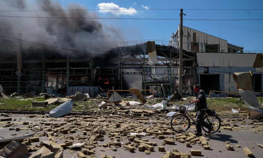 A local resident walks past an industrial building damaged by a Russian military strike in the town of Bakhmut, in Donetsk region, Ukraine.