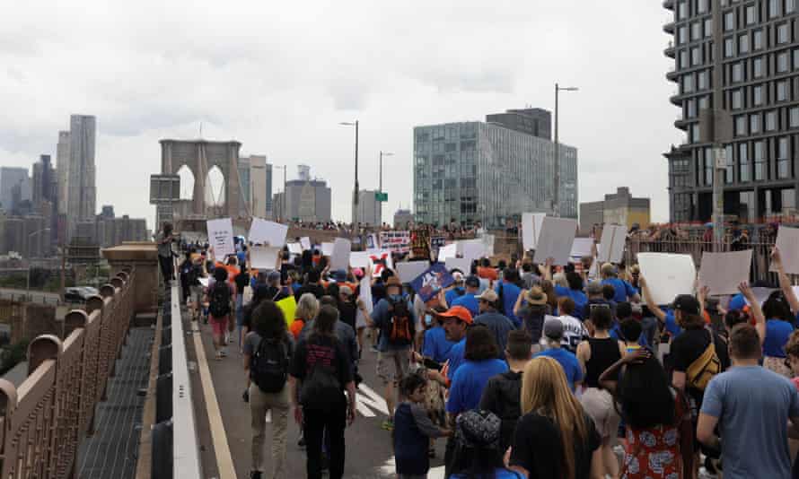 People cross the Brooklyn Bridge in one of a series of nationwide protests against gun violence.