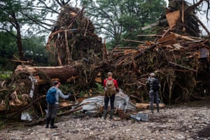 Search and rescue workers look through debris