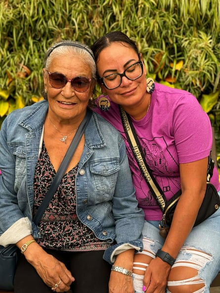 Two women sitting close together and smiling