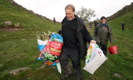 National Trust rangers carry away branches from the felled Sycamore Gap tree