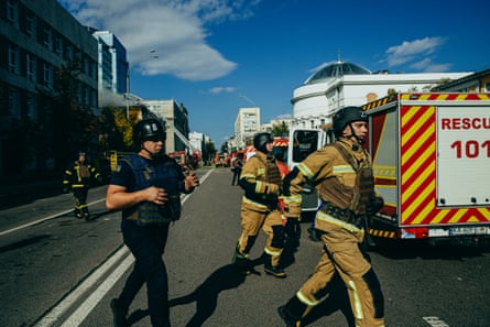 Rescue workers running to the shelter because of the air threat.