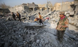 Iraqis inspect the damage at a site in the Hamam al-Alil area, about 14 kilometres from the southern outskirts of Mosul.