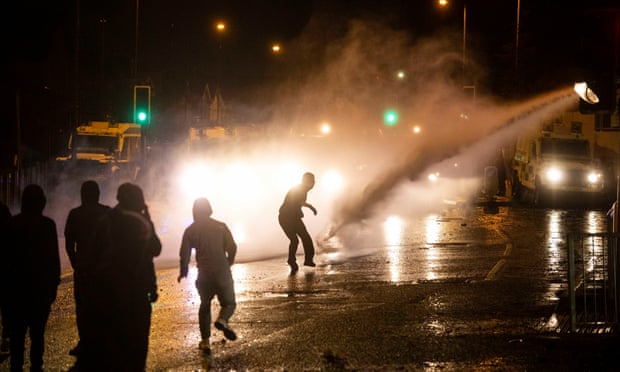 Youths clash with police in west Belfast, 8 April.