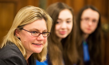 Justine Greening and girls in background