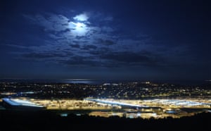 Moon illuminates the Eurotunnel terminal in UK