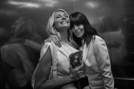 Tess Daly and Claudia Winkleman backstage clutching their award together