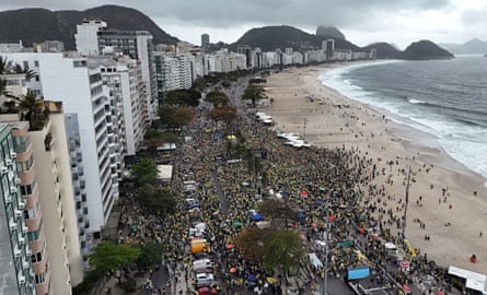 A drone view shows supporters of former Brazilian President Jair Bolsonaro lining the road that runs along Copacabana beach in Rio de Janeiro