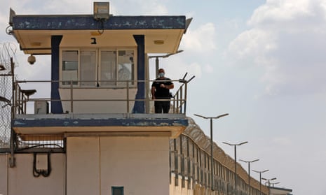 A police officer keeps watch from an observation tower at Gilboa prison in northern Israel