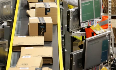 Staff label and package items at an Amazon warehouse.