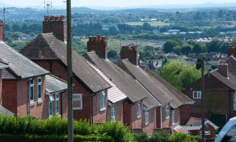 View of roof tops and privet hedges in a traditional English council housing estate