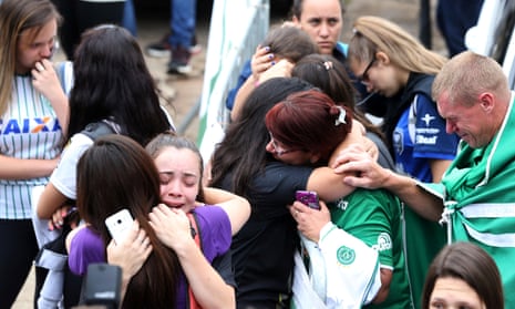 Fans of Chapecoense soccer team react in front of the Arena Conda stadium in Chapeco, Brazil.