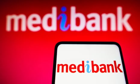 The Medibank logo on a smartphone and in the background