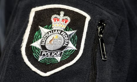 An Australian Federal Police logo.