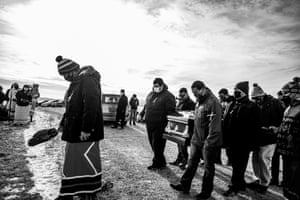 The death of husband and wife Jesse “Jay” and Cheryl Taken Alive delivered a major blow to the clan and the Standing Rock Tribe. They were buried on a family plot south of Cannon Ball, North Dakota. overlooking the Missouri River. Photographs made with the consent of the family. Coverage of COVID-19 on the Standing Rock Indian Reservation.