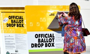 A woman casts her ballot in Santa Ana, California, on 13 October.