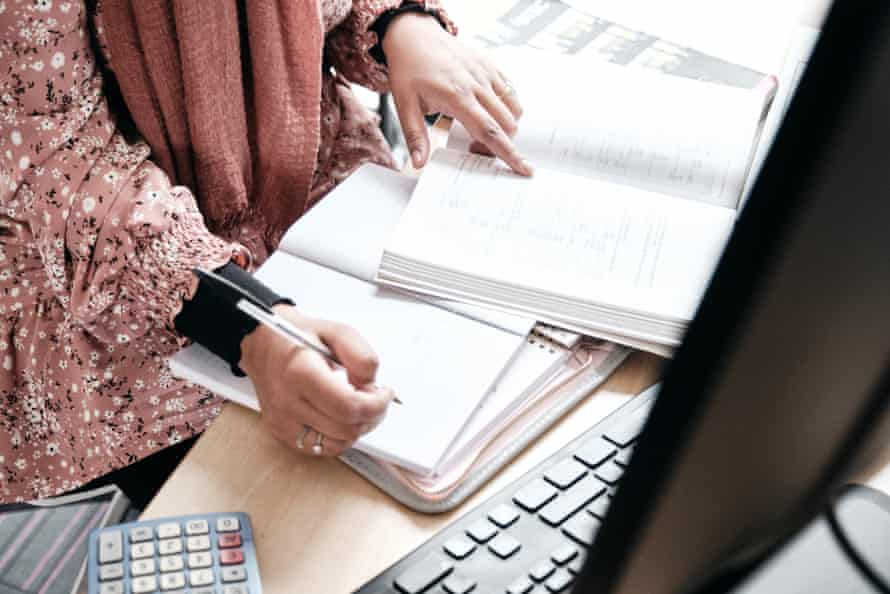 Mehnaz Ibrahim-Khan writes in a notebook