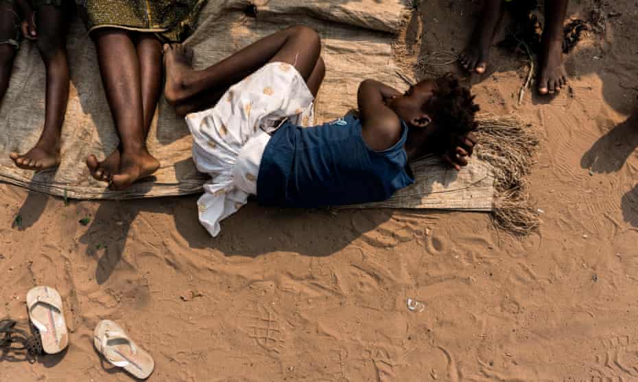 A woman rests at a camp for people fleeing conflict in the Congolese province of Kasai