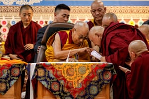 The Dalai Lama blesses a Buddhist monk during a ceremony marking his 90th birthday on Monday.