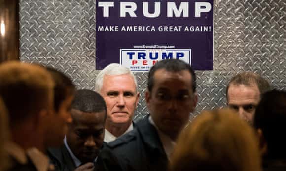 Vice President-elect Mike Pence, the head of Donald Trump's transition team, gets into an elevator at Trump Tower in New York City.