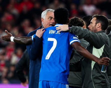 José Mourinho speaks with Vínicius Júnior, who remonstrates on the sidelines after denouncing racism in the stands to the referee.