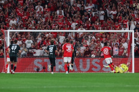 Benfica`s Jhon Duran (second right) scores a penalty against Celtic.