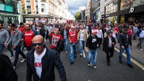 FC Köln fans march parade around Oxford Circus ahead of Arsenal clash – video
