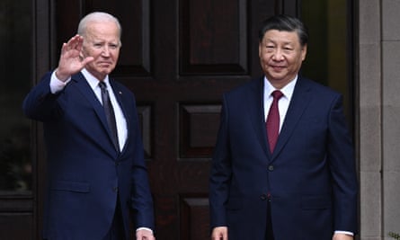 Joe Biden and Xi Jinping pose for the cameras, with Biden waving