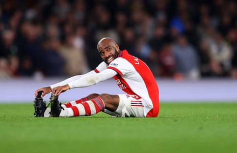 Alexandre Lacazette goes down with cramp and his evening is over.