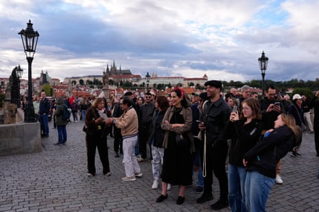 Dozens of people waiting to take a photo.