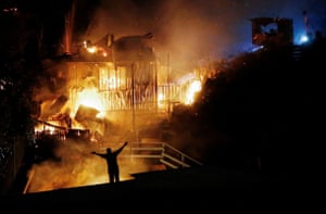 Houses burn amid a wildfire in Valparaiso