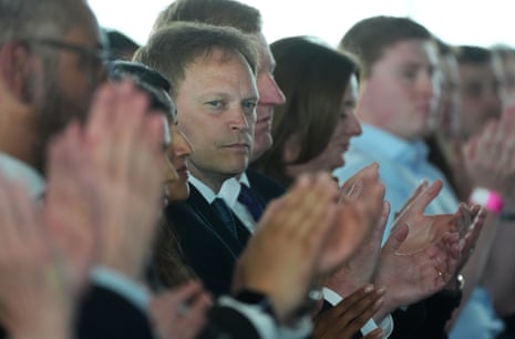 a man clapping in a crowd